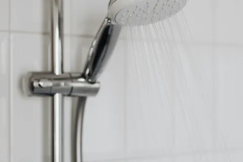 a shower head in a bathroom