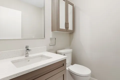 a bathroom with a sink and toilet