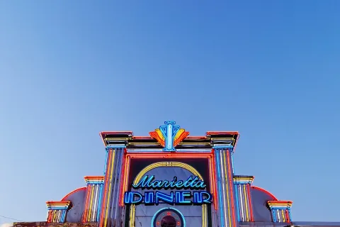 a colorful building with a sign on it