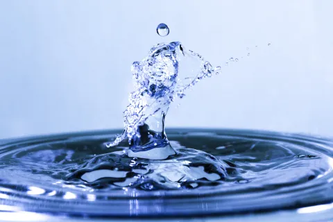 a drop of water falling into water