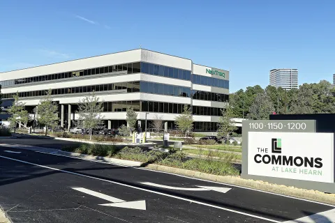 a large building with a sign in front of it