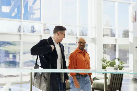 a man looking at another man