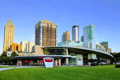 a large building with a green lawn