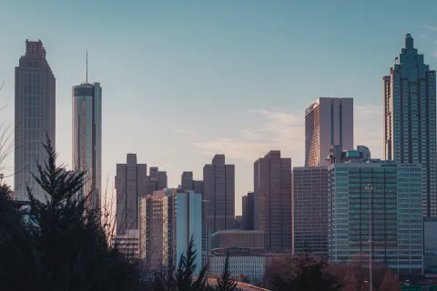 a city skyline with tall buildings