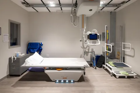 a hospital room with a bed and medical equipment
