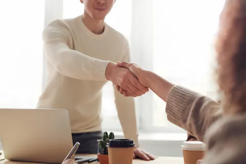 a man and a woman shaking hands