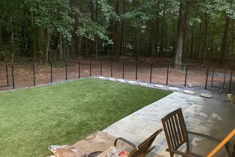 a deck with chairs and a table