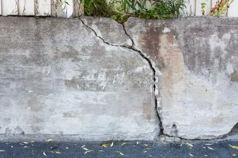 a concrete wall with a hole in it