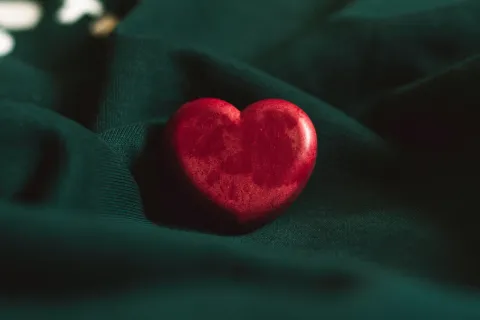 a red heart that demonstrates care