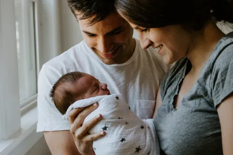 a man holding a baby