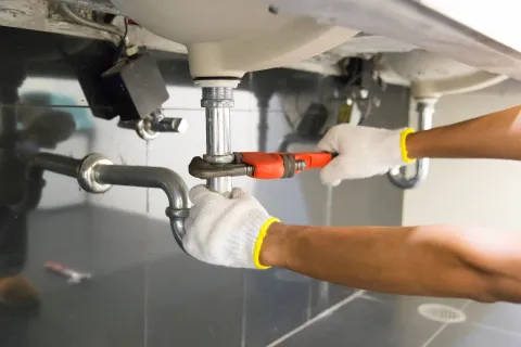 close-up of a person's hand holding a syringe