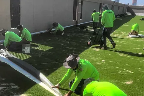 a group of people working on a solar panel