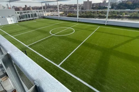 a sports field with a fence