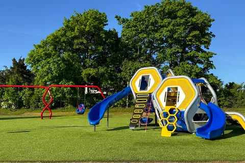 a yellow and blue playground toy