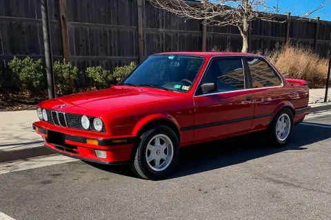 a red car parked on the side of the road