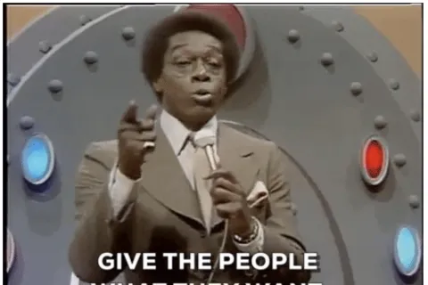 a man in a suit pointing