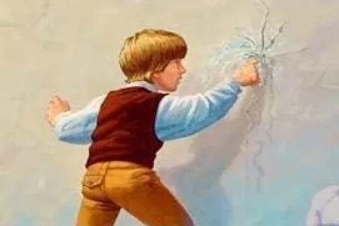 Young boy with brown hair cracks a wall with his fist, wearing a blue shirt and brown vest and pants.