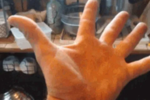 a hand with a finger extended