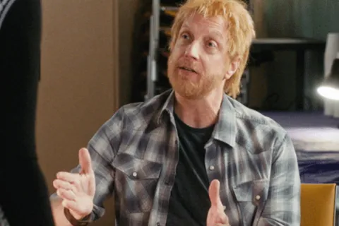 Chris Elliott with his hands up