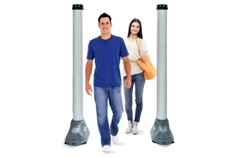 a man and a woman standing next to a lamp post