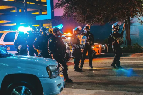 a group of people in riot gear