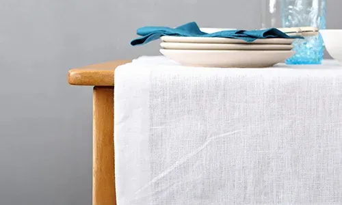 Leave cleaning your tablecloths and cloth napkins to us