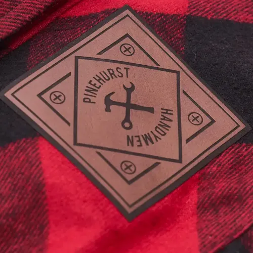 a red and white square with a symbol on it