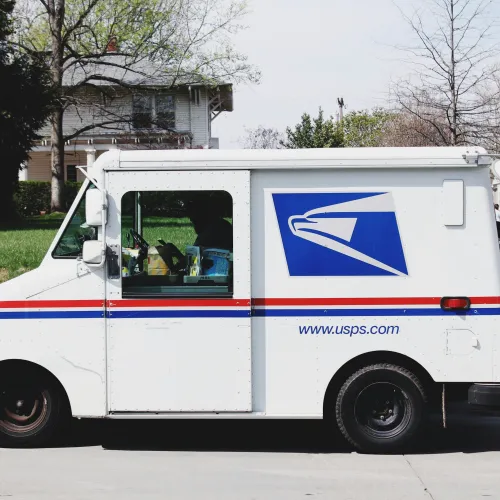 a white van with a blue and red stripe