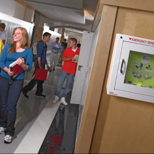 a group of people standing in a hallway