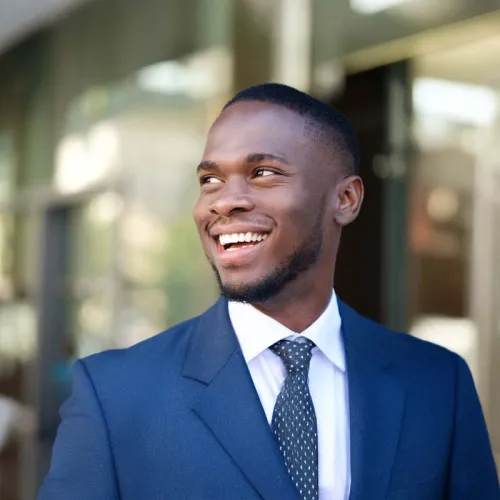 man in a suit smiling