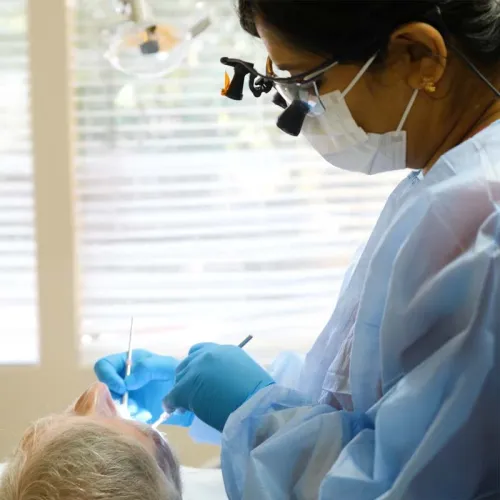 a dentist looking at a patient