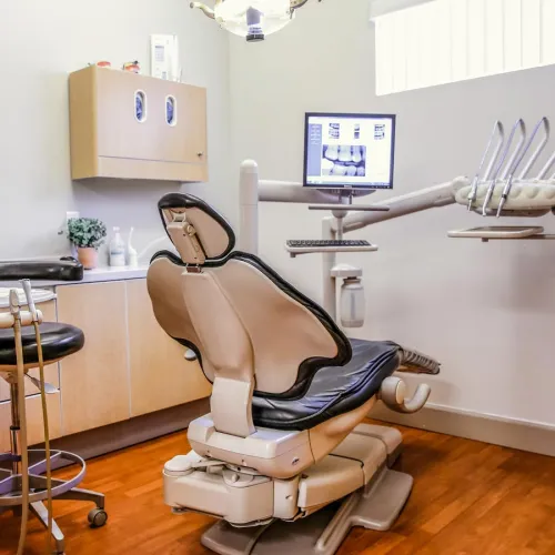 Modern dental office with a comfortable chair and dental equipment ready for patient use.