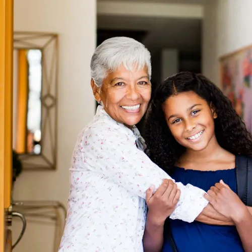 grandmother hugging teen