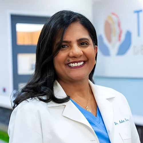 Smiling female doctor in white coat