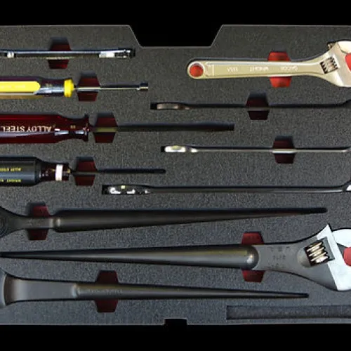 Set of various hand tools including screwdrivers, adjustable wrenches, and ratchets organized in a foam tray.
