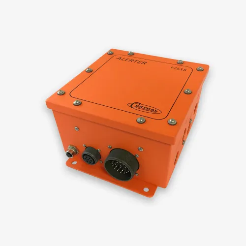 Orange industrial alert device box with multiple connectors and labeled ALERTER on top, isolated on white.