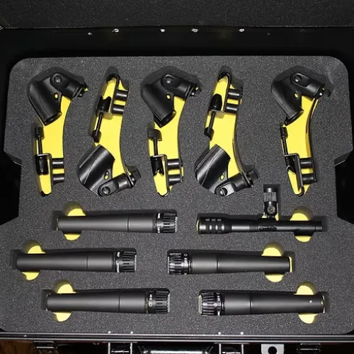 Black and yellow drum microphone clamps and eight black drum microphones in a protective foam case.
