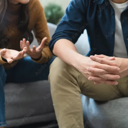 a man and a woman sitting on a couch