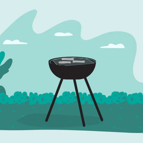 Black charcoal grill standing on three legs in a green garden with plants and bushes under a blue sky.
