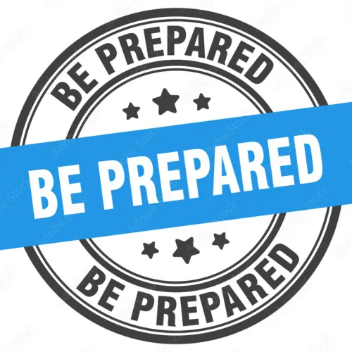 Round stamp with black text Be Prepared and a blue banner with white Be Prepared text