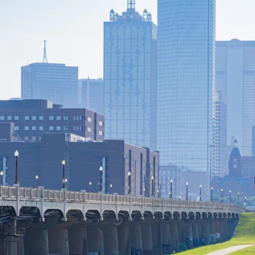 a bridge with a city in the background