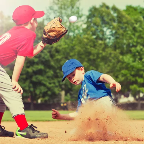 a couple of kids playing baseball