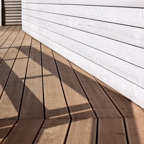 a wooden deck with a tile floor