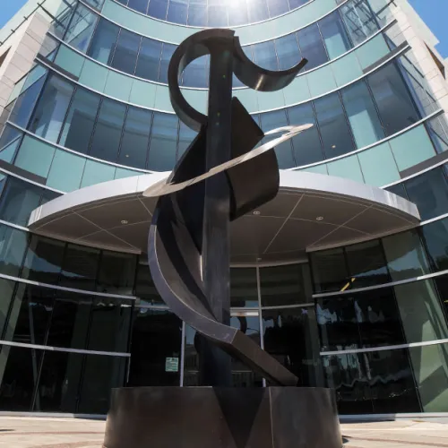 a statue in front of a building