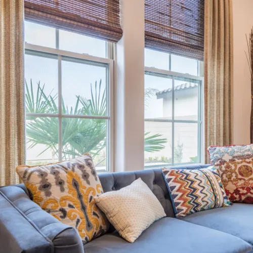 a living room filled with furniture and a large window