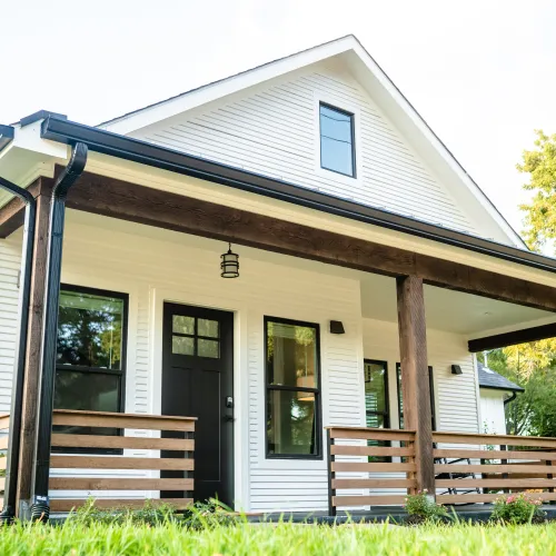 a house with new replacement windows and a porch