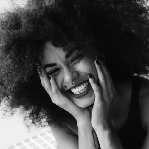 a woman with her hand on her face