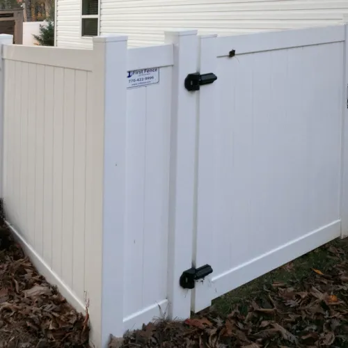 a white shed with a black door
