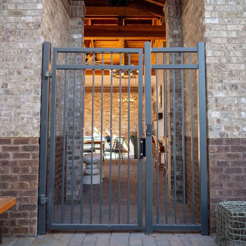 a gate in a brick building
