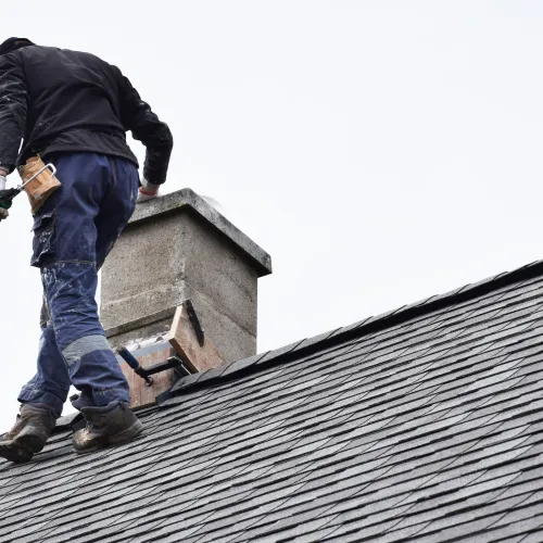 a man on a roof